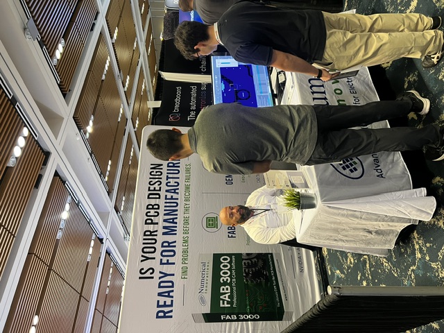 Engineers talking with Simon Garrison about FAB 3000 at PCB West 2026